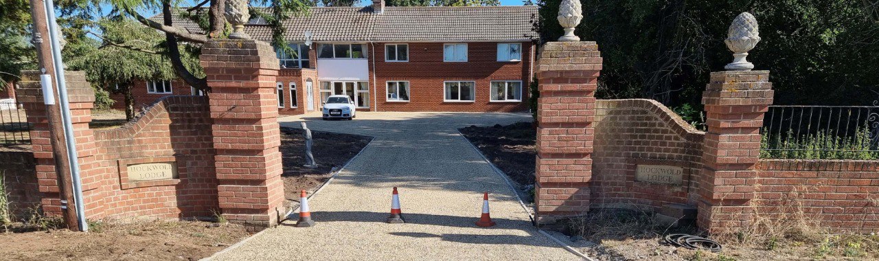 This is a photo of a newly installed chip and tar driveway, installed by Hawkhurst Driveways